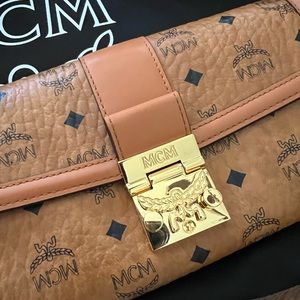 NWOT MCM “Tracy” large wallet with chain, box and dust bag. Never used.